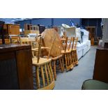 A set of five pine kitchen chairs, two similar chairs and an octagonal coffee table In need of