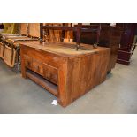 A rustic square coffee table with storage wells and drawers, w. 85 cm Stains and wear