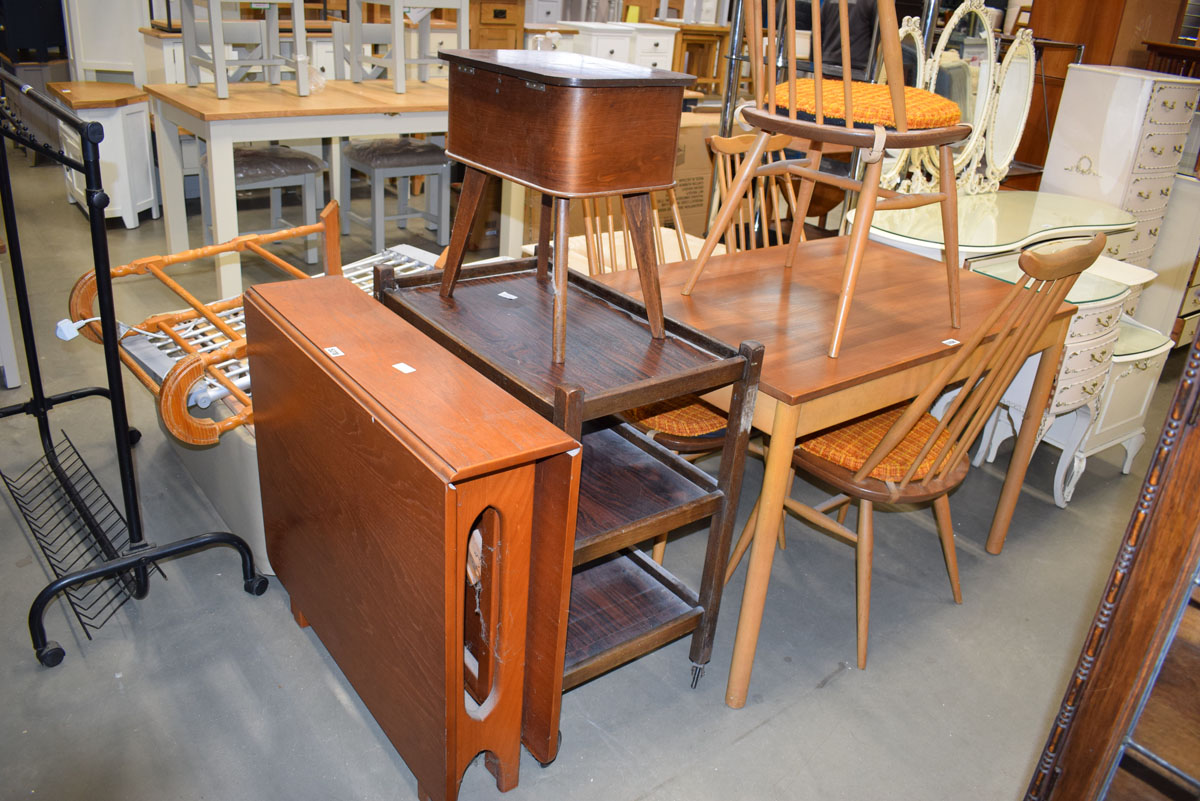 A 1970's tea drop leaf dining table, an oak three tier tea trolley and a mid 20th century sewing