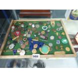 Tray with a quantity of badges