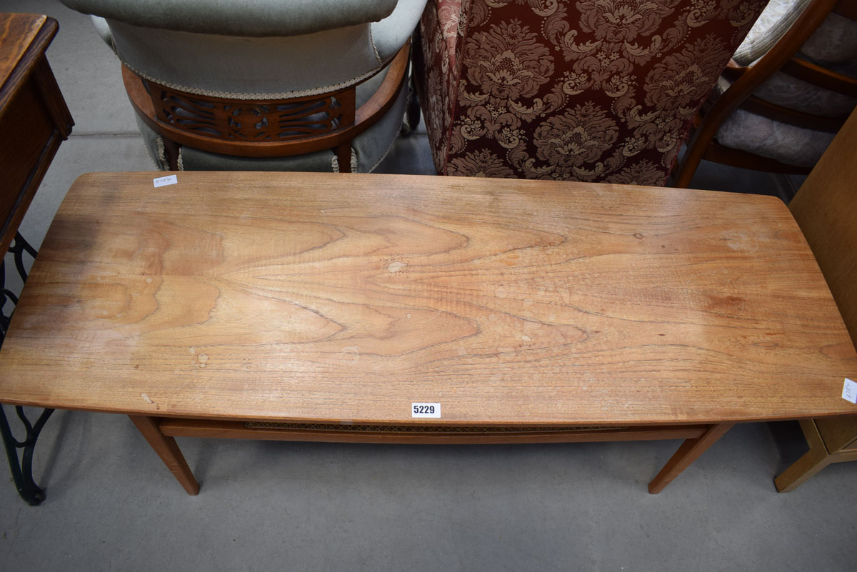 A 1970's teak coffee table with caned second tier, w. 128 cm Cane is intact. Heat/water marks - Image 2 of 2