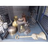 Cage containing a brass doorstop, cat shaped doorstop, copper and brass jugs plus a metal novelty