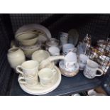 Cage containing Colclough leaf patterned crockery and Royal Doulton Florinda daisy patterned