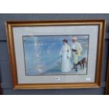 Framed and glazed print of Edwardian figures on the beach
