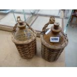 2 Charles Wells flagons in wicker baskets