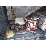 Cage containing meat platters and dinner plates, brass fire companion set, flat iron and