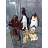 Resin figure of a fisherman, 2 China penguins and 4 other figures of animals and children