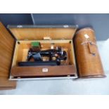 2 cased Singer sewing machines