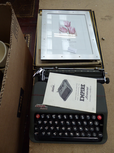 Empire travelling typewriter plus a quantity of prints and a photo frame