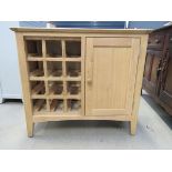 Oak sideboard with single cupboard door and wine rack