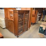 An early 20th century leaded glazed oak cabinet, w. 91 cm