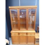 Glazed beech 3 door display cabinet with cupboard base under plus a matching TV cabinet