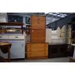 A 1970's teak chest of three graduated drawers, w. 82 cm, together with a pair of matching bedside
