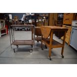 A 1970's brown plastic and chrome tea trolley and two oak tea trolleys Fair condition