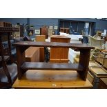 A small mahogany two shelf bookcase/stool, w. 82 cm