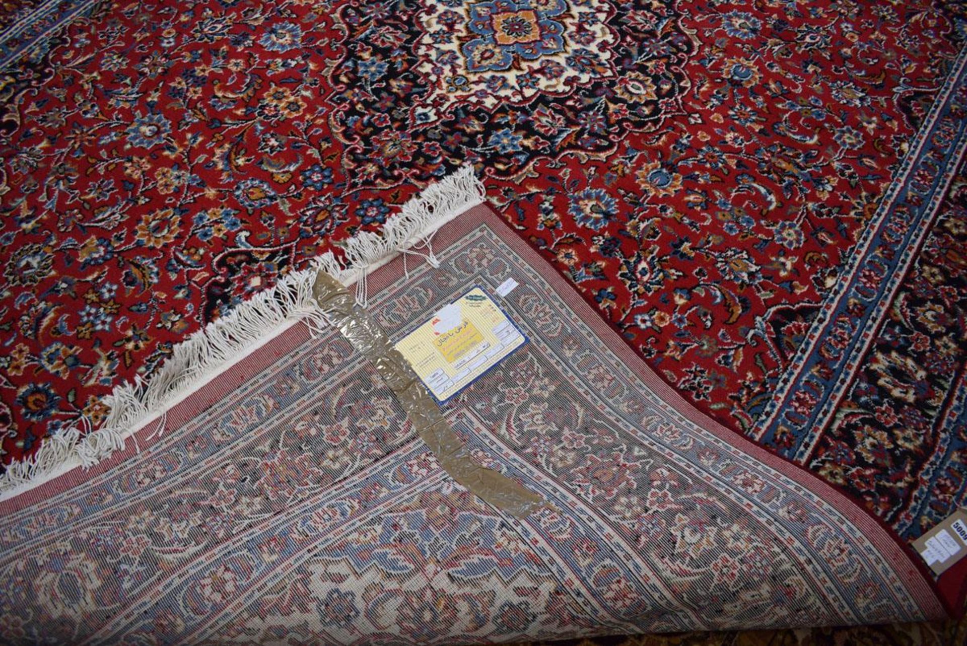 (11) An Iranian Pamchal carpet, red ground and blue border with Persian style foliate decoration - Image 4 of 4