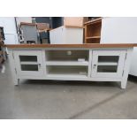 Cream painted oak top TV audio unit with 2 shelves and 2 glazed single doors (47)