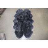 A grey Windward sheepskin rug, approx. 180 x 110 cm