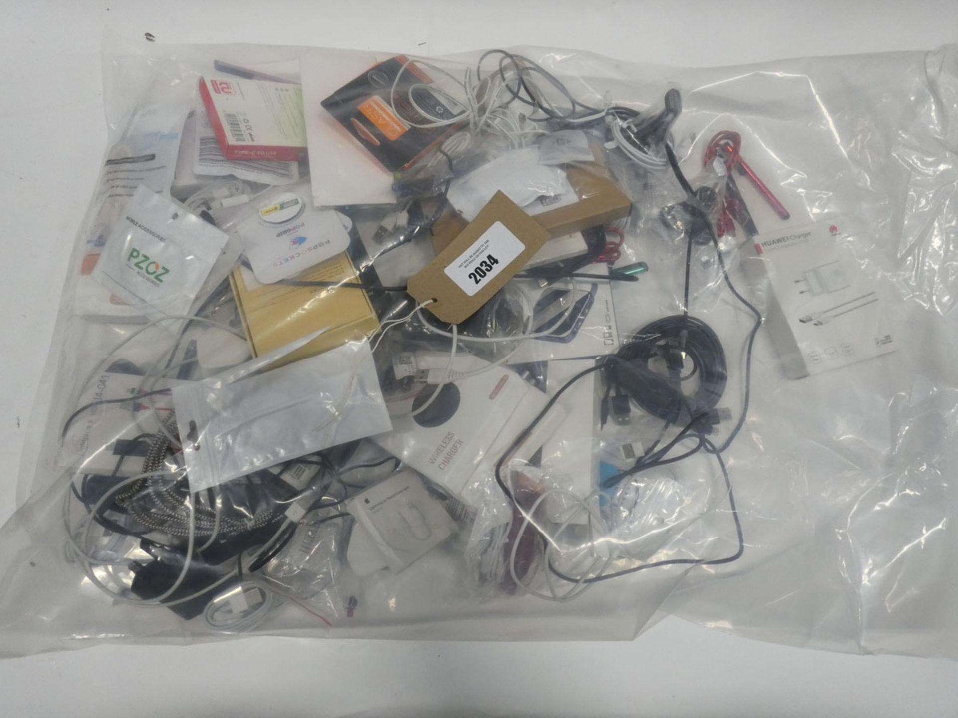 Bag containing quantity of mobile phone accessories; adapters, chargers, leads, earphones etc