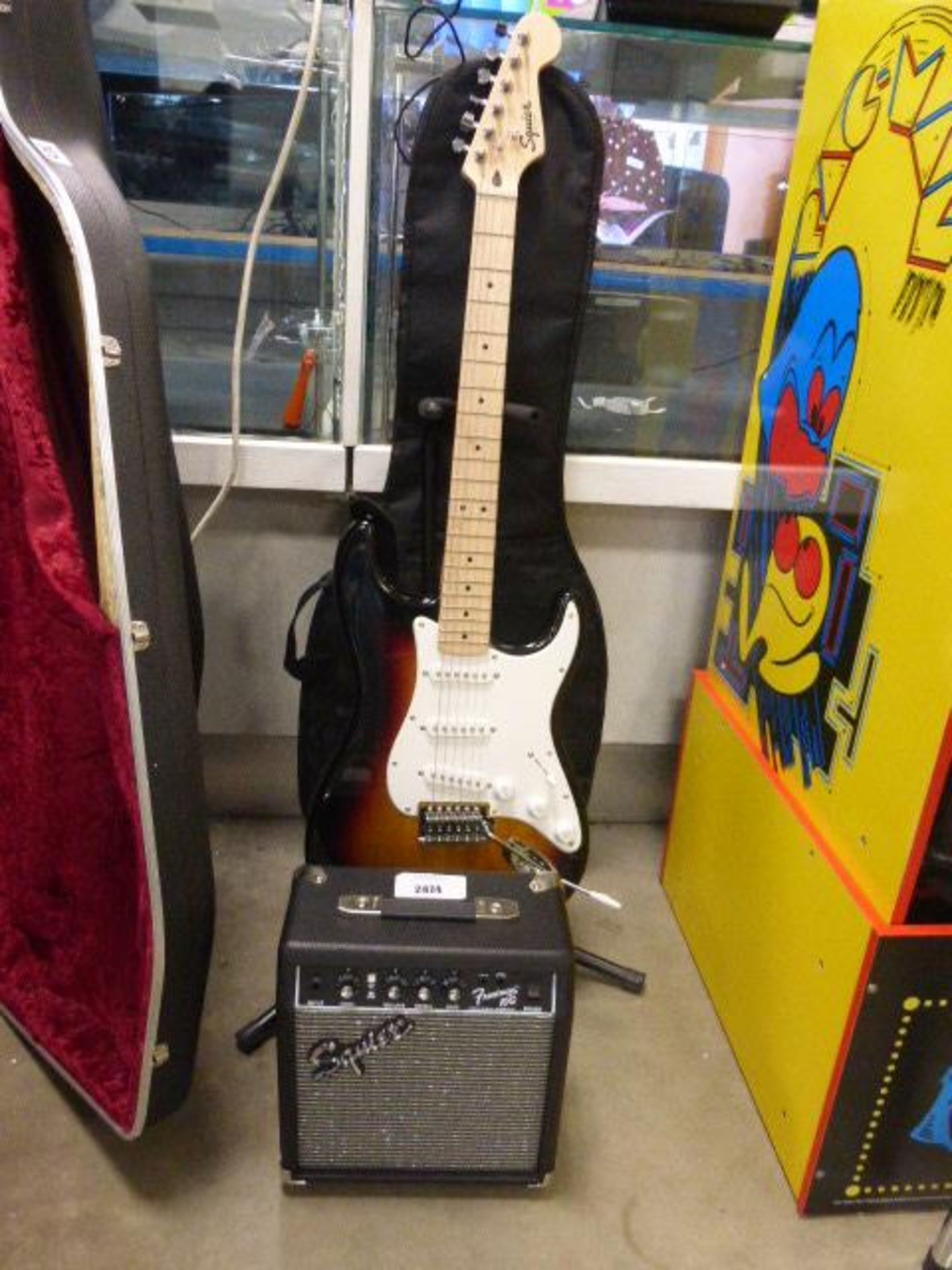 Squire Stratocaster by Fender 6 string electric guitar with carry case and Frontman 10g practice