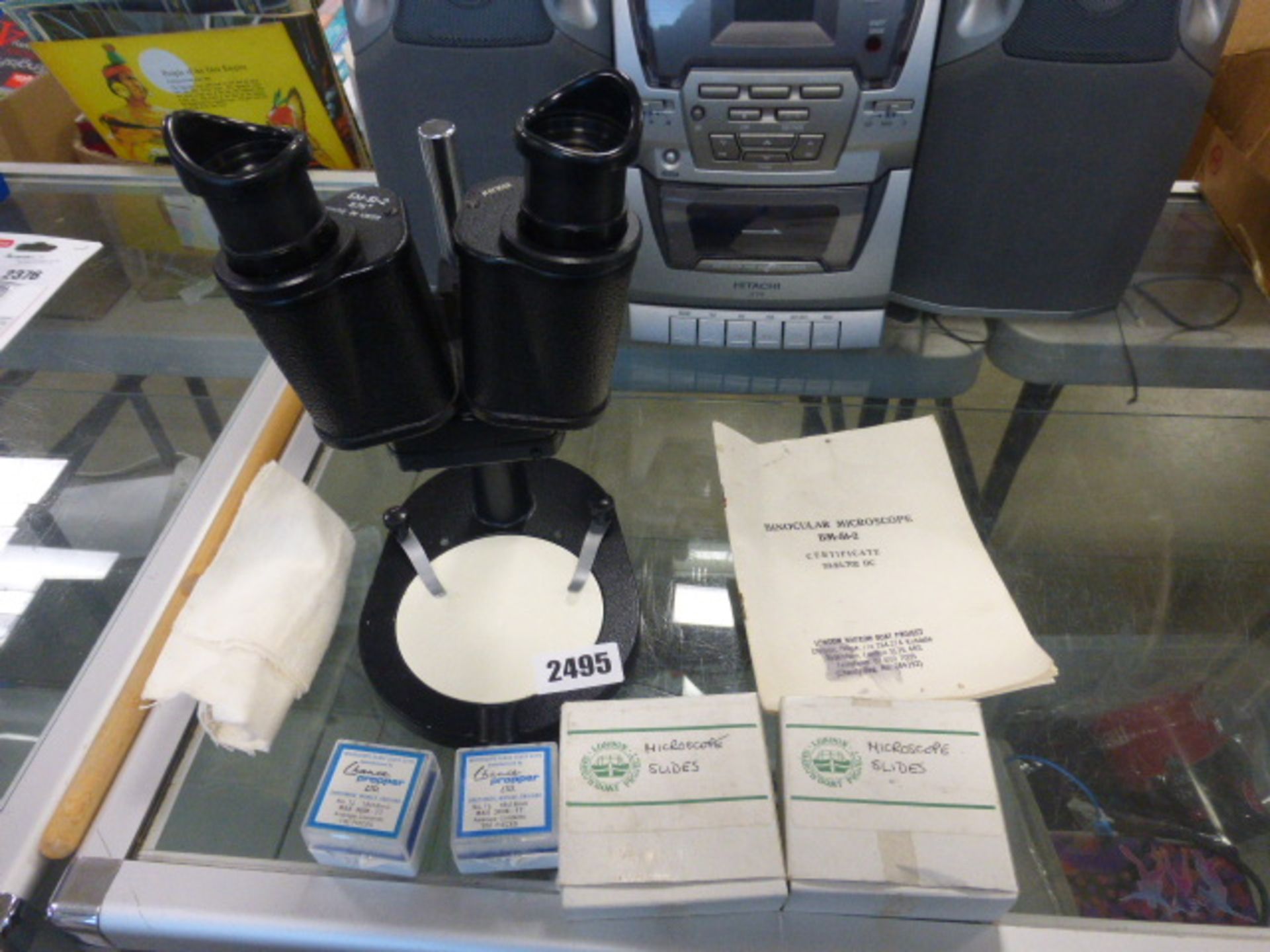 Binocular microscope with certificate and slides