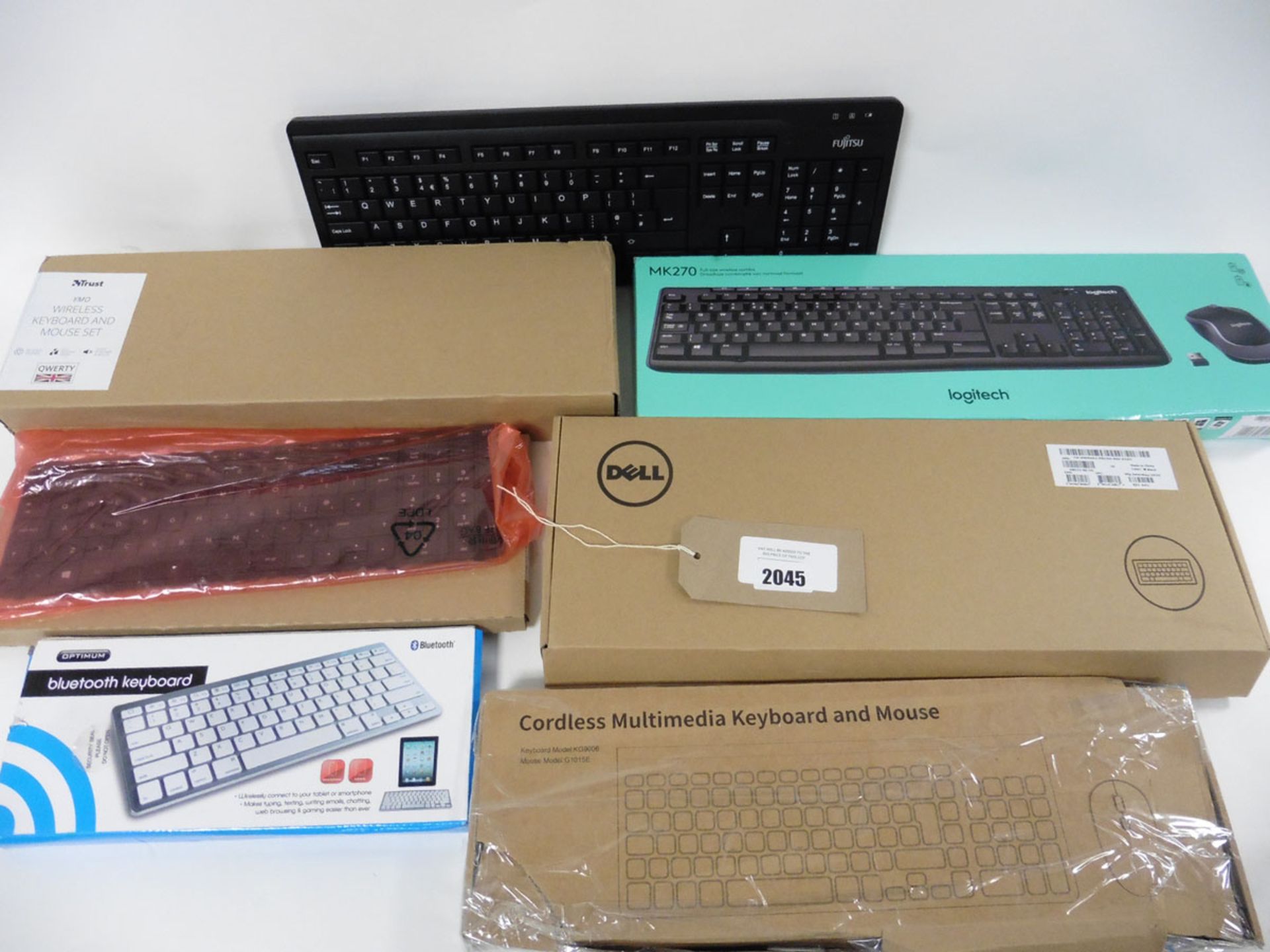 A bag of keyboards inc bluetooth, wireless sets with mice, replacement laptop keyboard etc