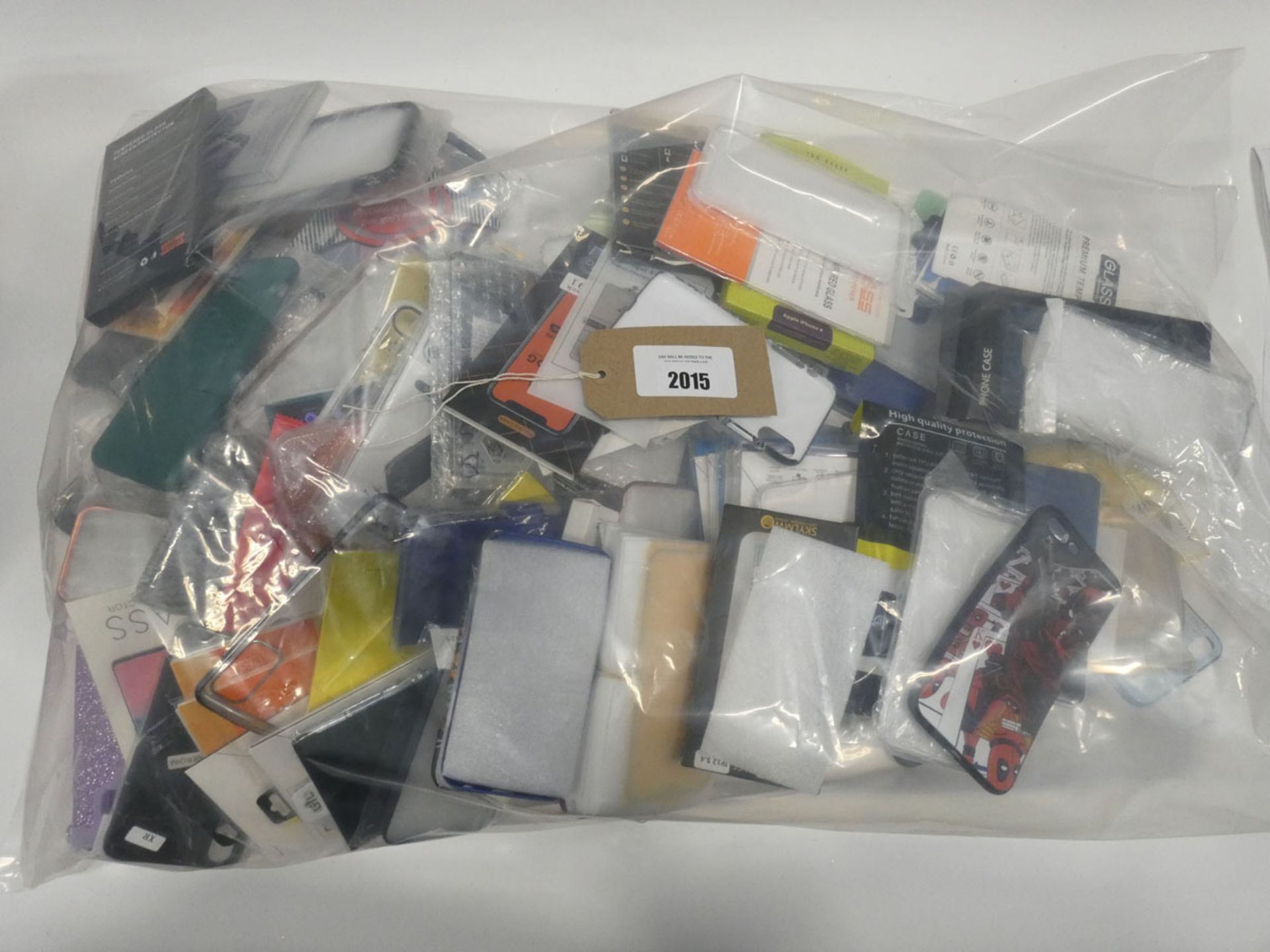 Bag containing quantity of mobile phone covers and cases