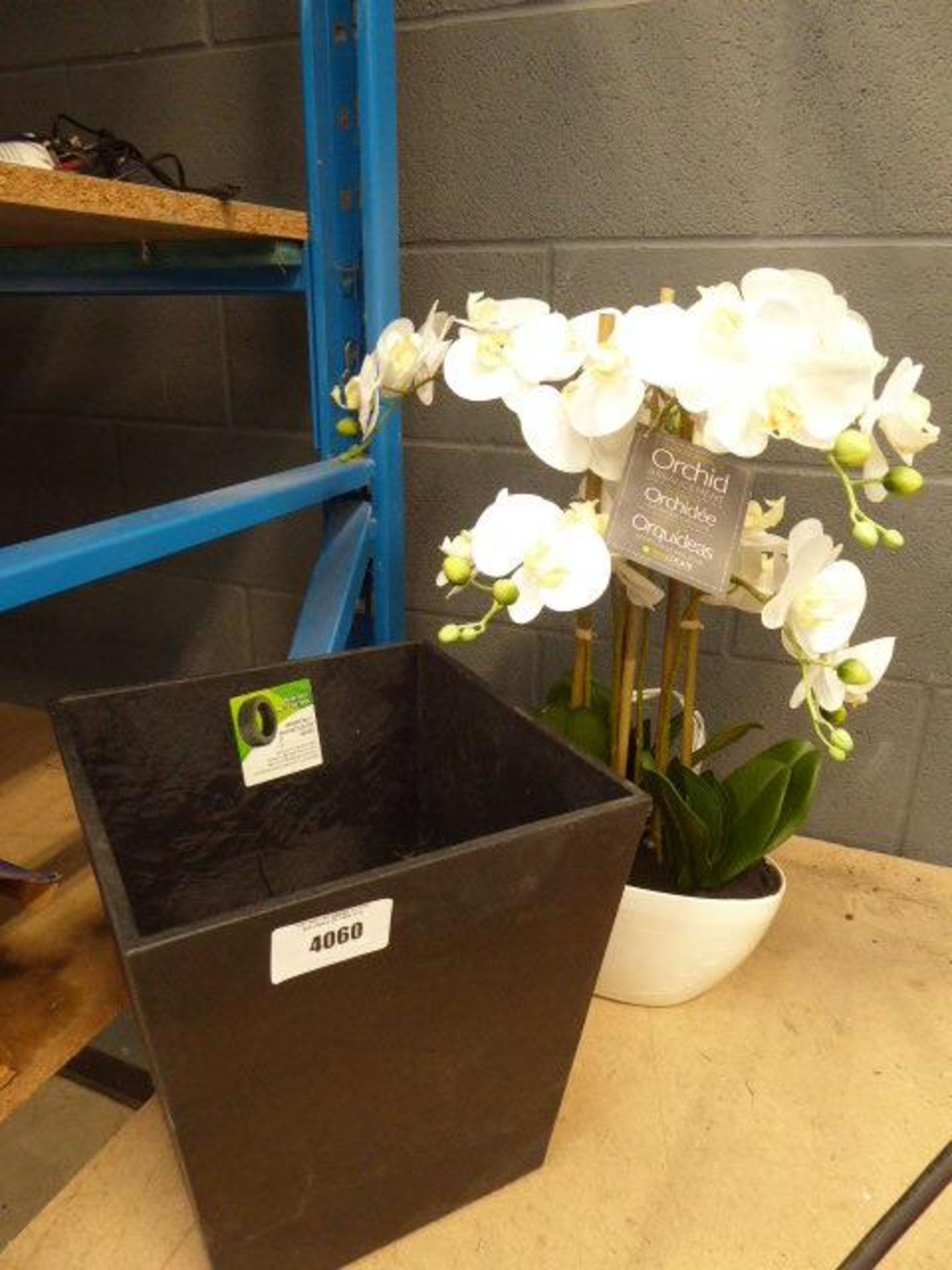 Artificial orchid and rubberised pot