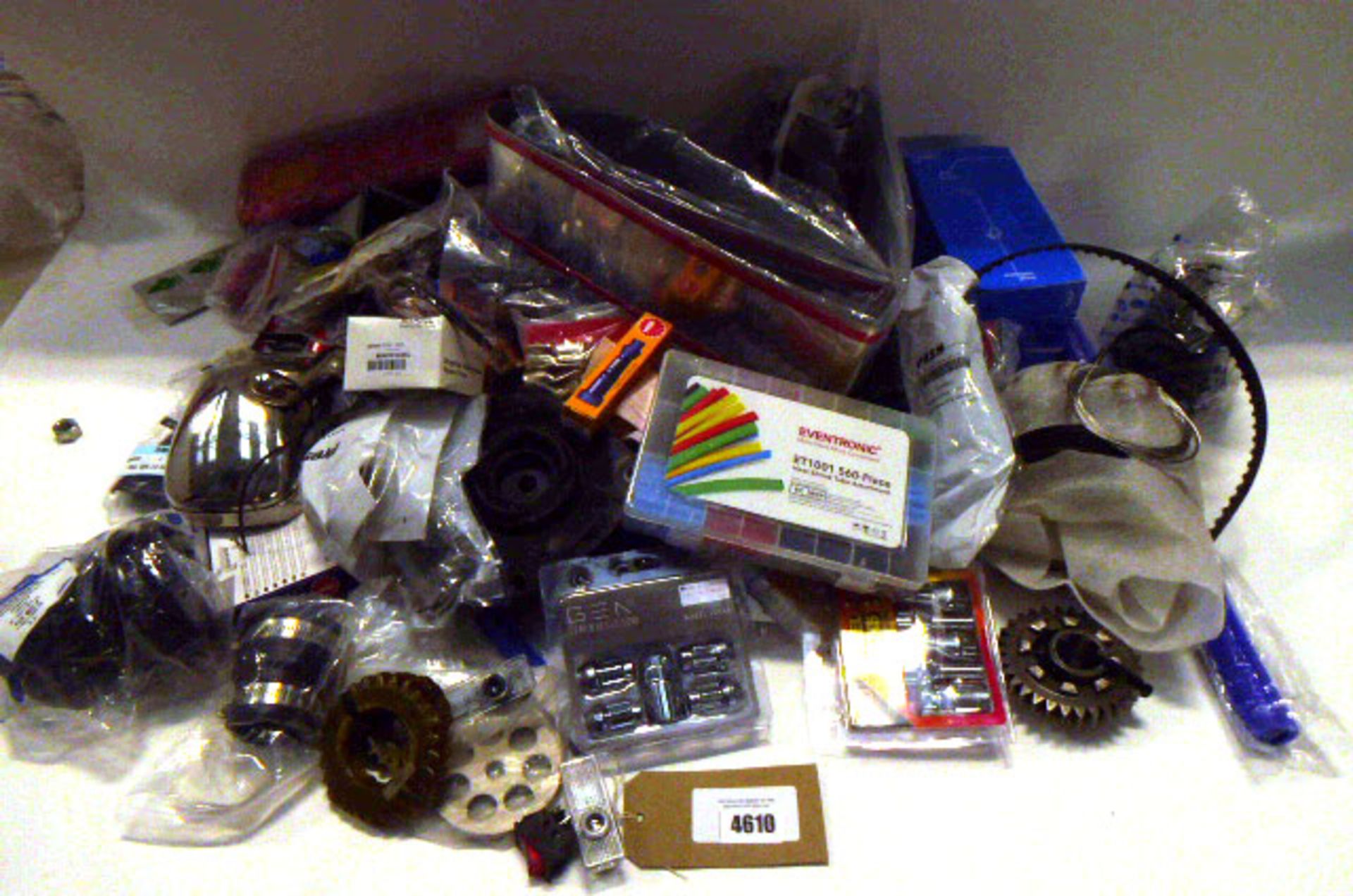 Bag containing wheel bolts, wheel nuts, cogs, hoses, lights, lenses, timing belts and other car