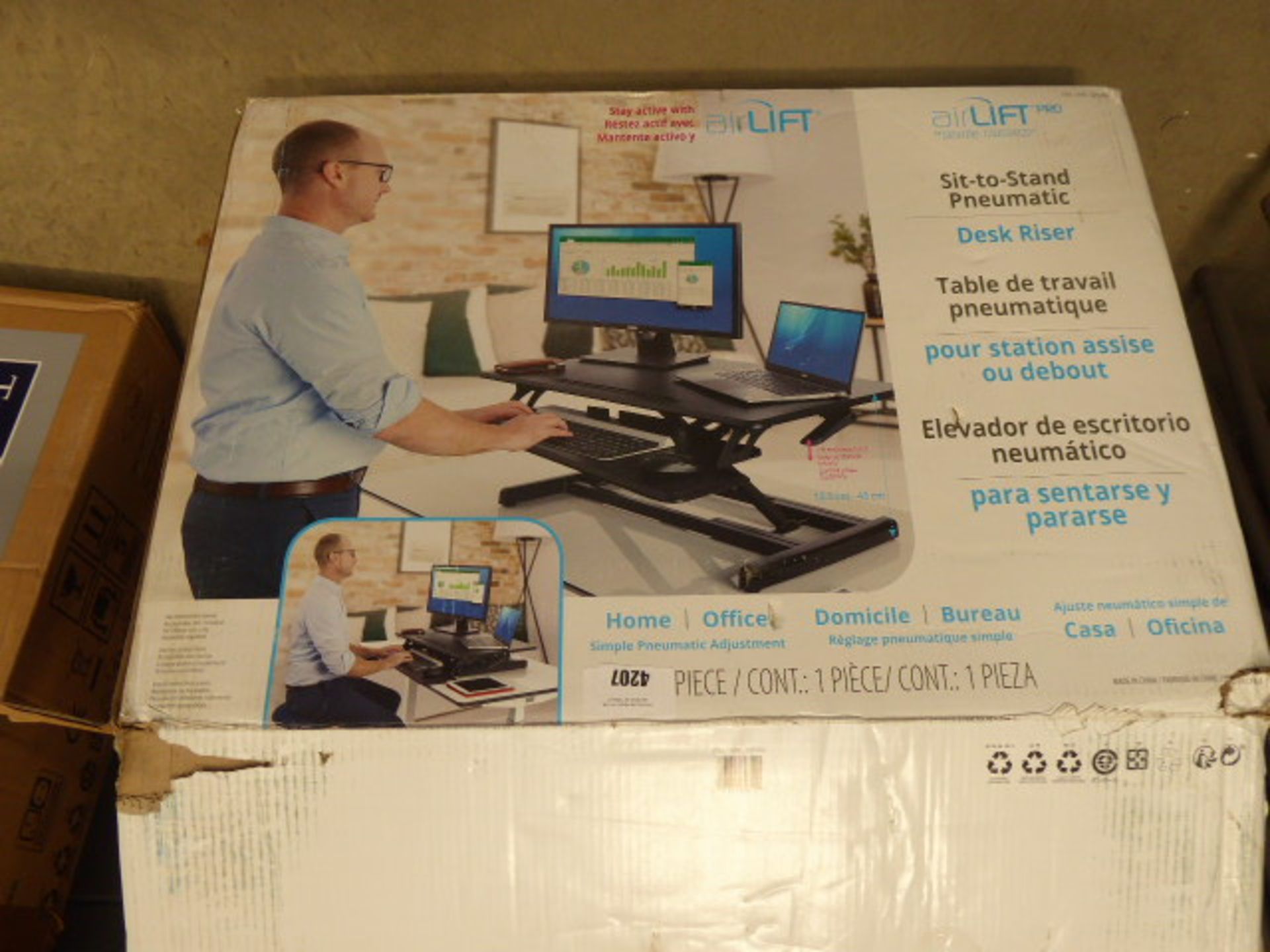 Airlift desk riser, boxed Item appears to be in ok condition