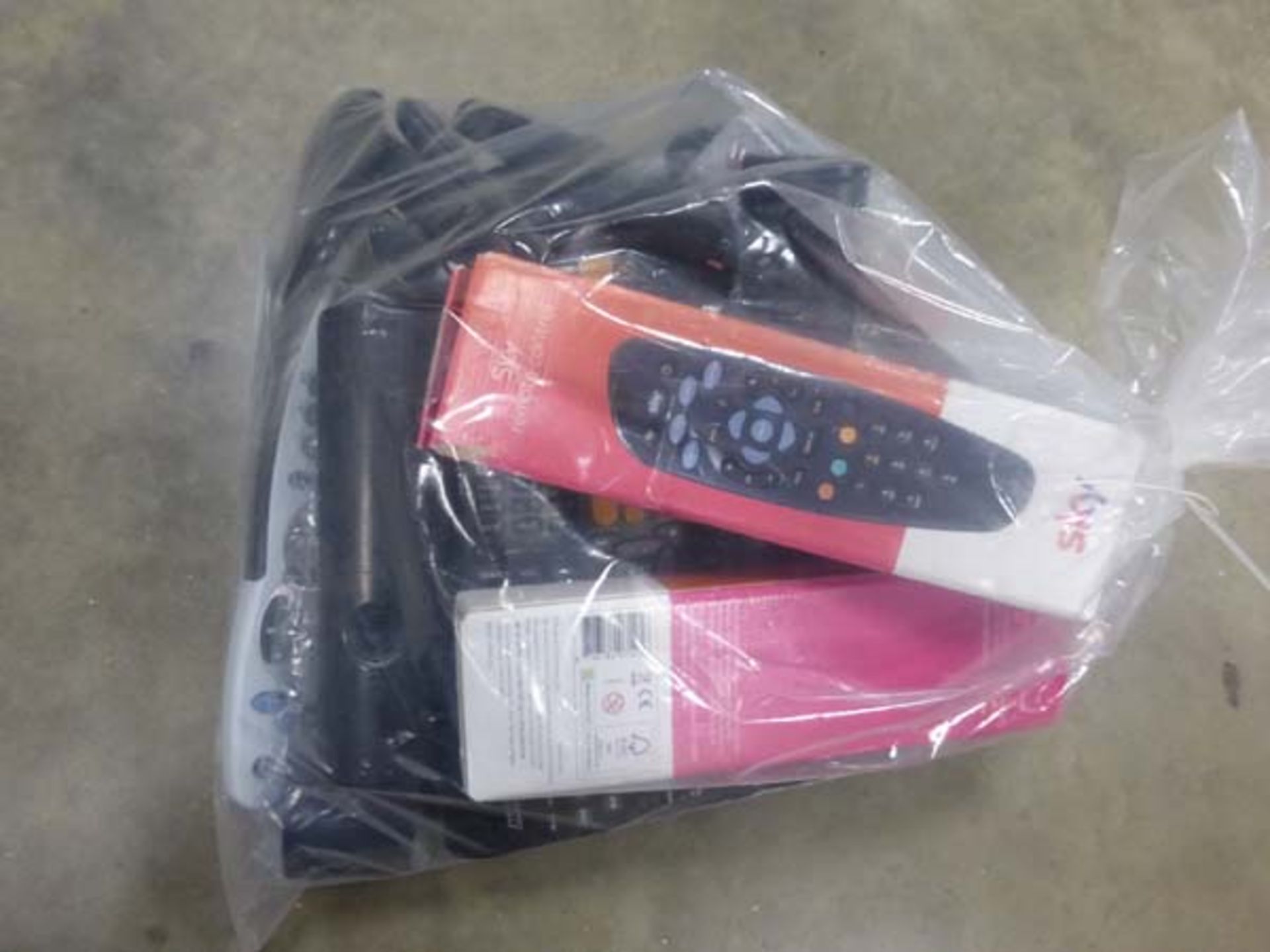 Bag containing various replacement remote controls - Image 2 of 2