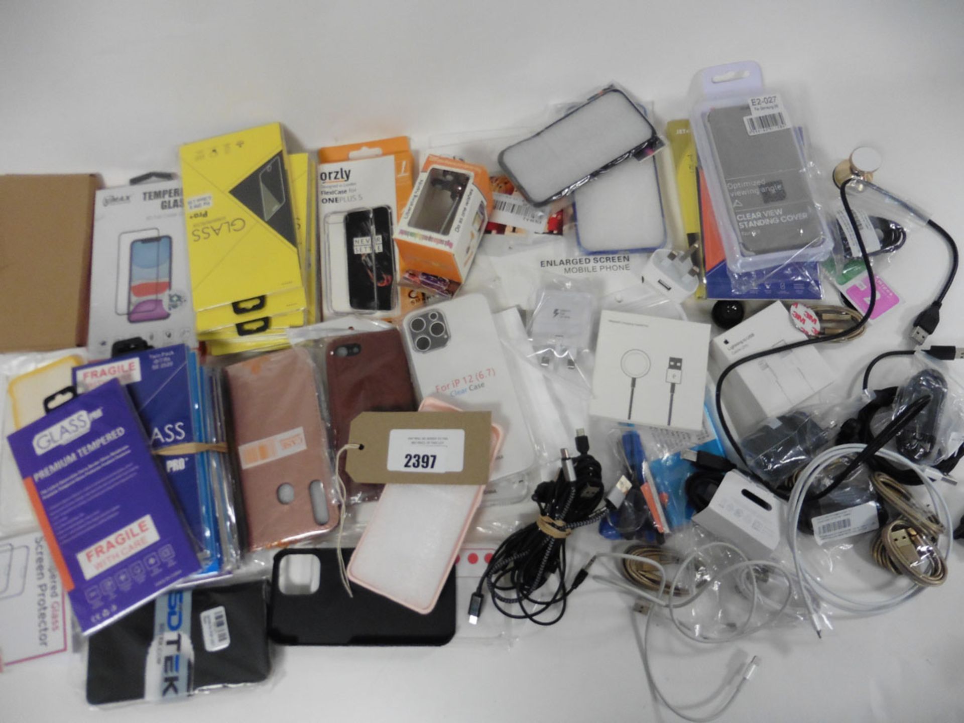 A bag of mobile phone accessories, lightening cables, USB-C, Glass screen protectors, cases etc.