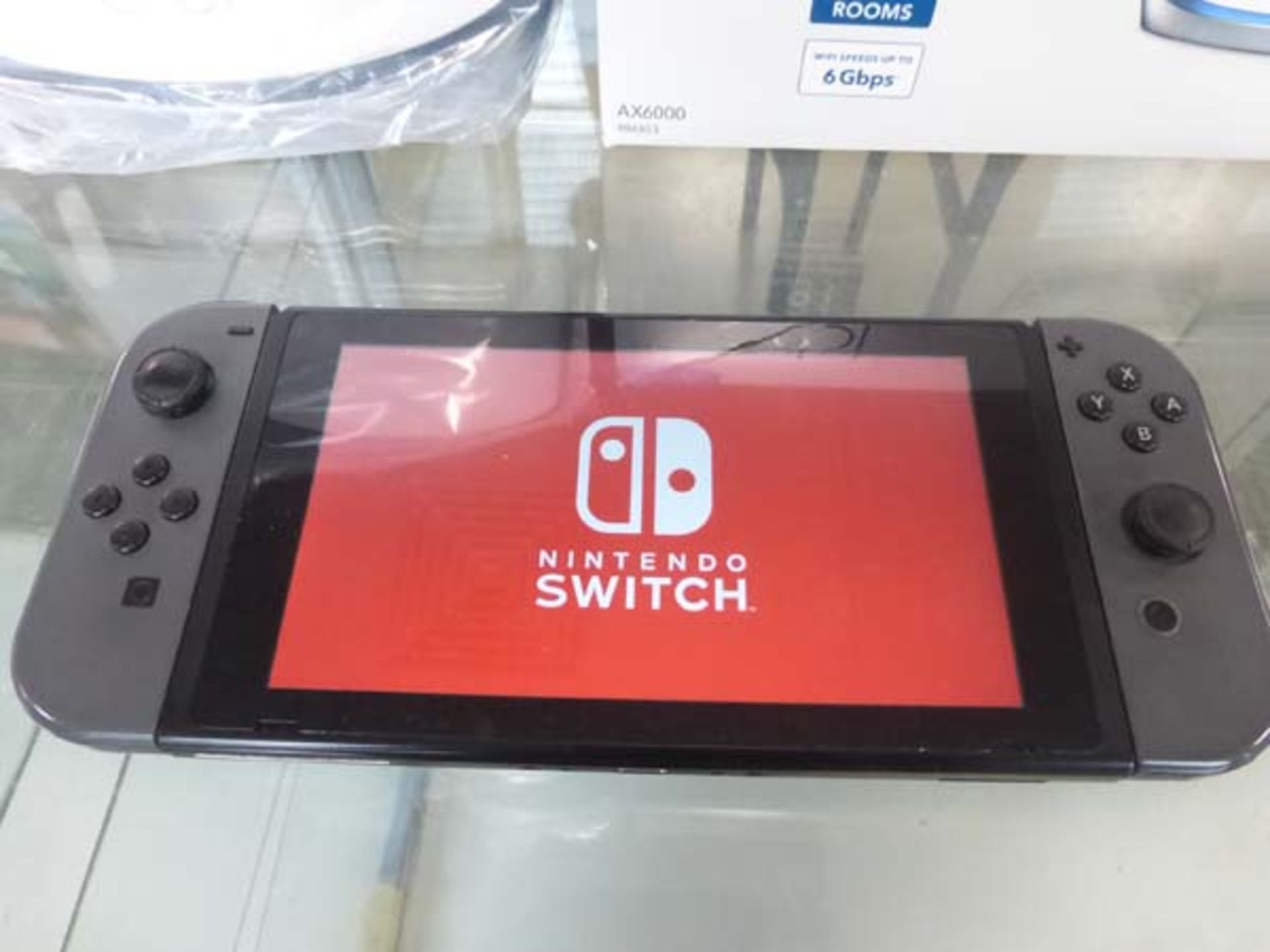 Nintendo Switch console with 2 joycons, charger, dock and controller grip - Image 2 of 2