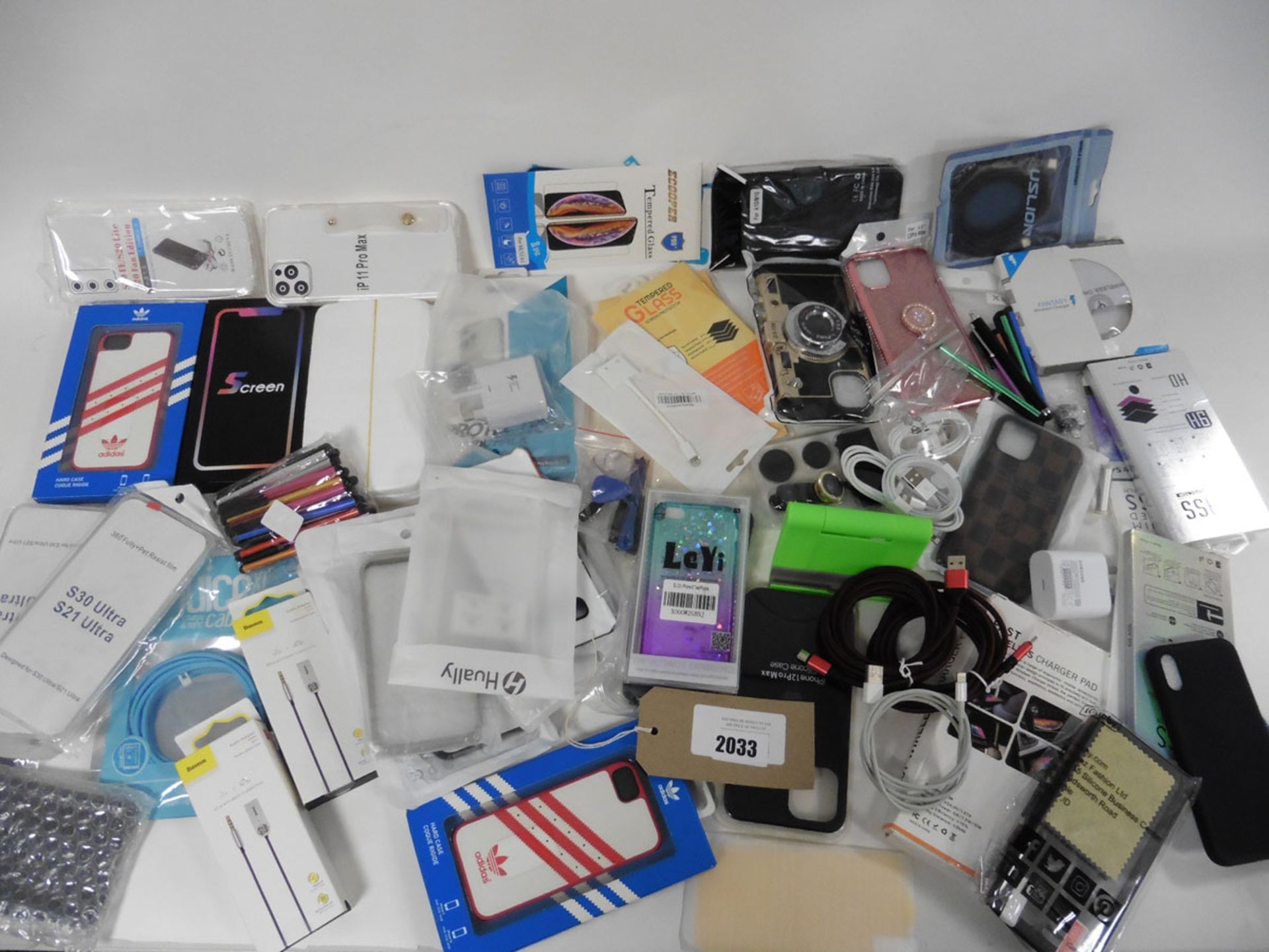 A bag of mobile phone accessories, chargers, power banks cases, screen protectors etc