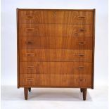 A 1960's Danish teak chest of six long drawers, each with an integral moulded handle,
