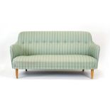 A Swedish 'Samas' cocktail sofa in green striped button upholstery, on beech legs,