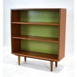 A Danish teak open adjustable bookcase on tapering feet, w.