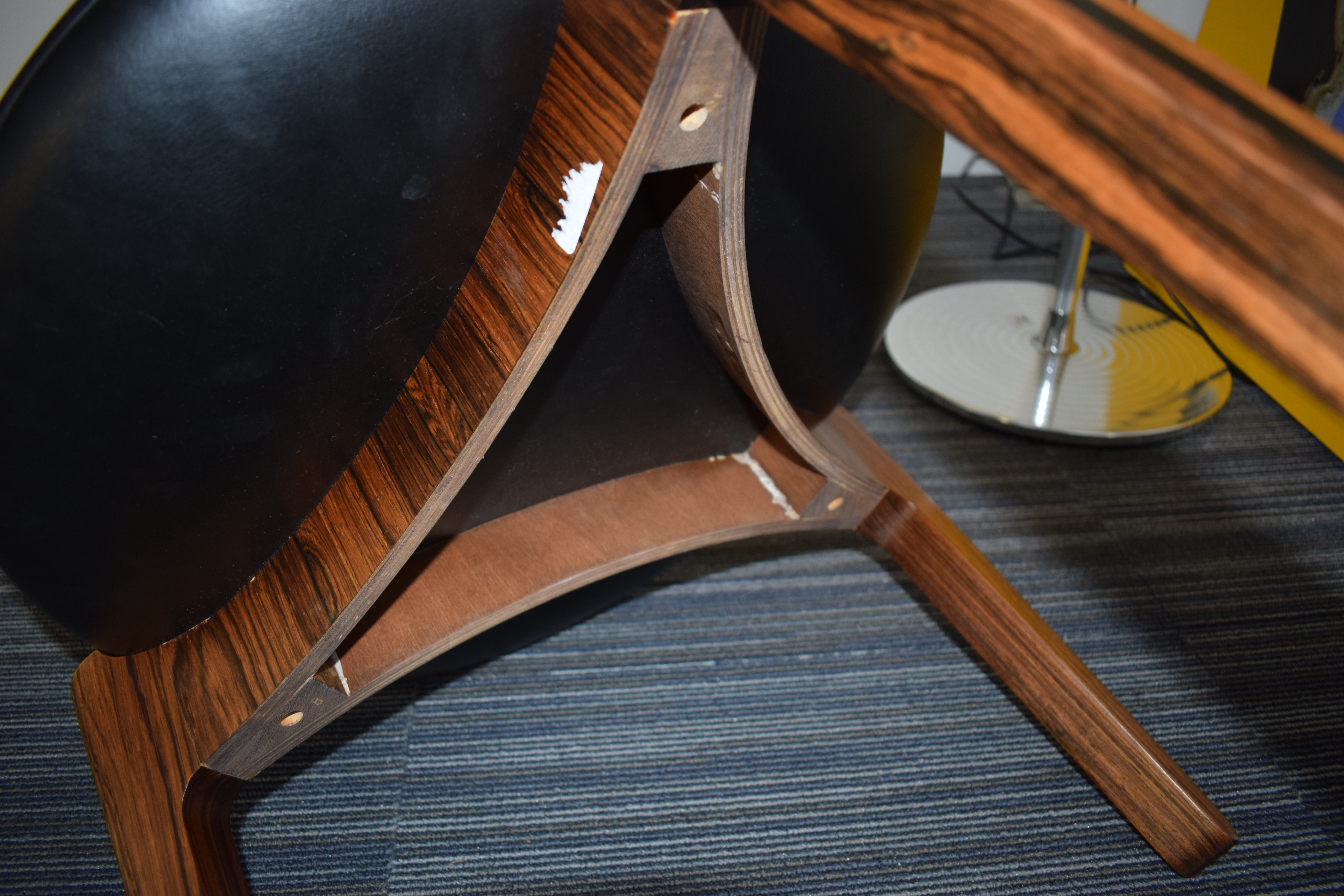 A 1960's rosewood and ebonised stool with black upholstery over a tri-form base *Sold subject to - Image 6 of 7