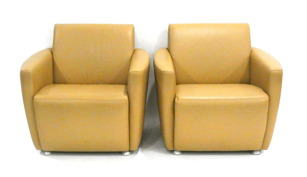 A pair of Davison Highley club armchairs upholstered in pale brown leather *Sold subject to our