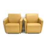 A pair of Davison Highley club armchairs upholstered in pale brown leather *Sold subject to our