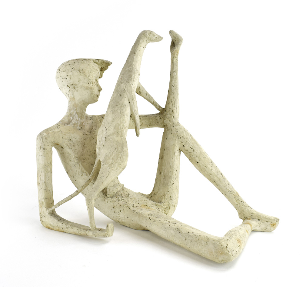 A plaster sculpture modelled as a reclining boy and a meercat, h.