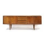 A 1960/70's teak and crossbanded sideboard, the four central drawers flanked by two pairs of doors,