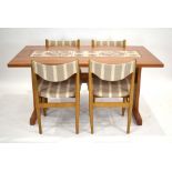 A 1970's dining suite including a teak, crossbanded and tile-topped table, 153 x 91 cm,