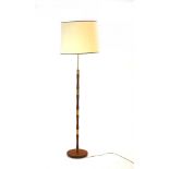 A 1960's turned teak and brass segmented standard lamp with cream shade CONDITION REPORT: