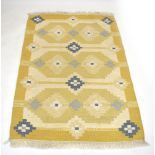 A 1960/70's Swedish Rya rug, pale yellow and blue geometric design,