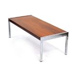 A 1970's rosewood coffee table with chromed supports, l.