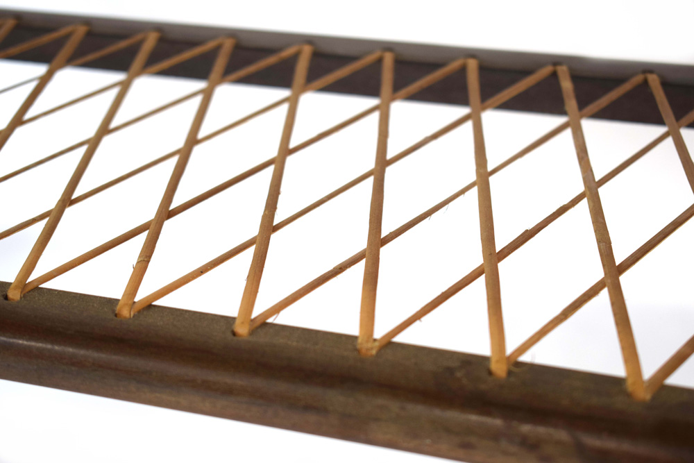 A 1960's Danish teak coffee table, the curved rectangular surface over a wicker criss-cross tier, - Image 4 of 6