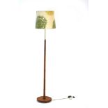 A 1960's turned teak faux bamboo standard lamp with cream floral patterned shade