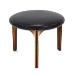 A 1960's rosewood and ebonised stool with black upholstery over a tri-form base *Sold subject to