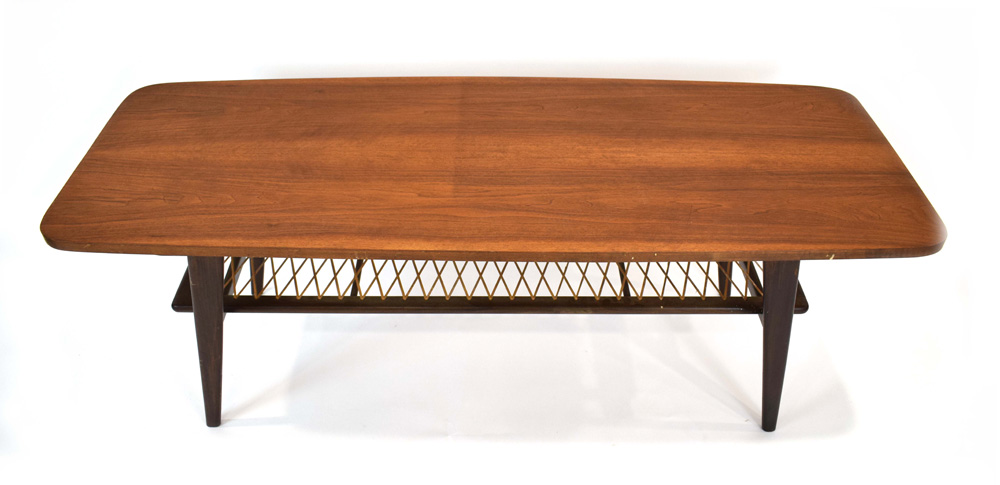 A 1960's Danish teak coffee table, the curved rectangular surface over a wicker criss-cross tier, - Image 2 of 6